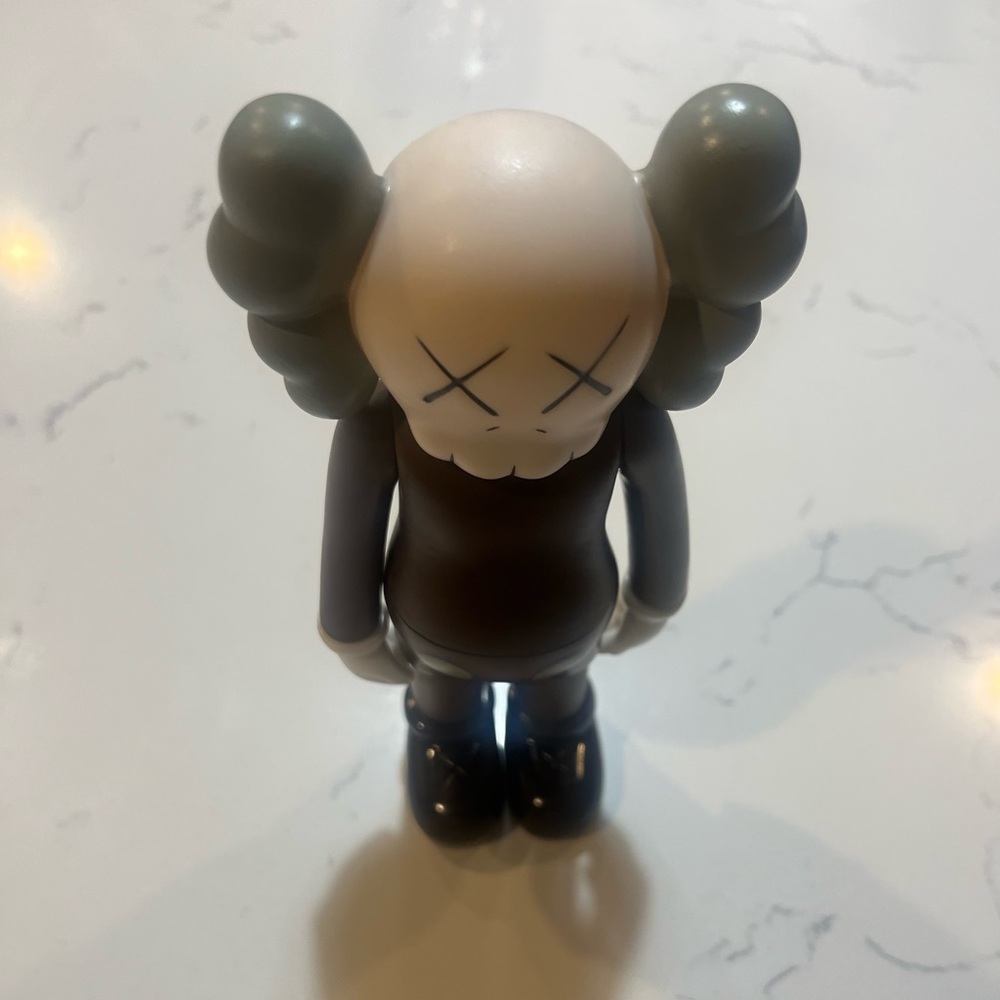 Gray and Black Collectible Figure